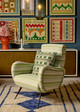 The Lost and Found cushion in Green adds a pop of pattern and texture to the Julian Chichester chair, upholstered in Go With the Flow fabric. A seamless fusion of vibrant green tones and bold graphics creates a striking, balanced design.